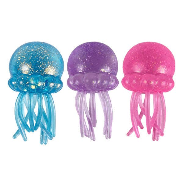 Three jellyfish-shaped toys in blue, purple, and pink on a white background