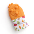 Itzy Ritzy - Itzy Mitt Pop™: Carrot baby teething mitten with textured orange silicone top and colorful fruit and vegetable print fabric wristband, stylish kids accessory.