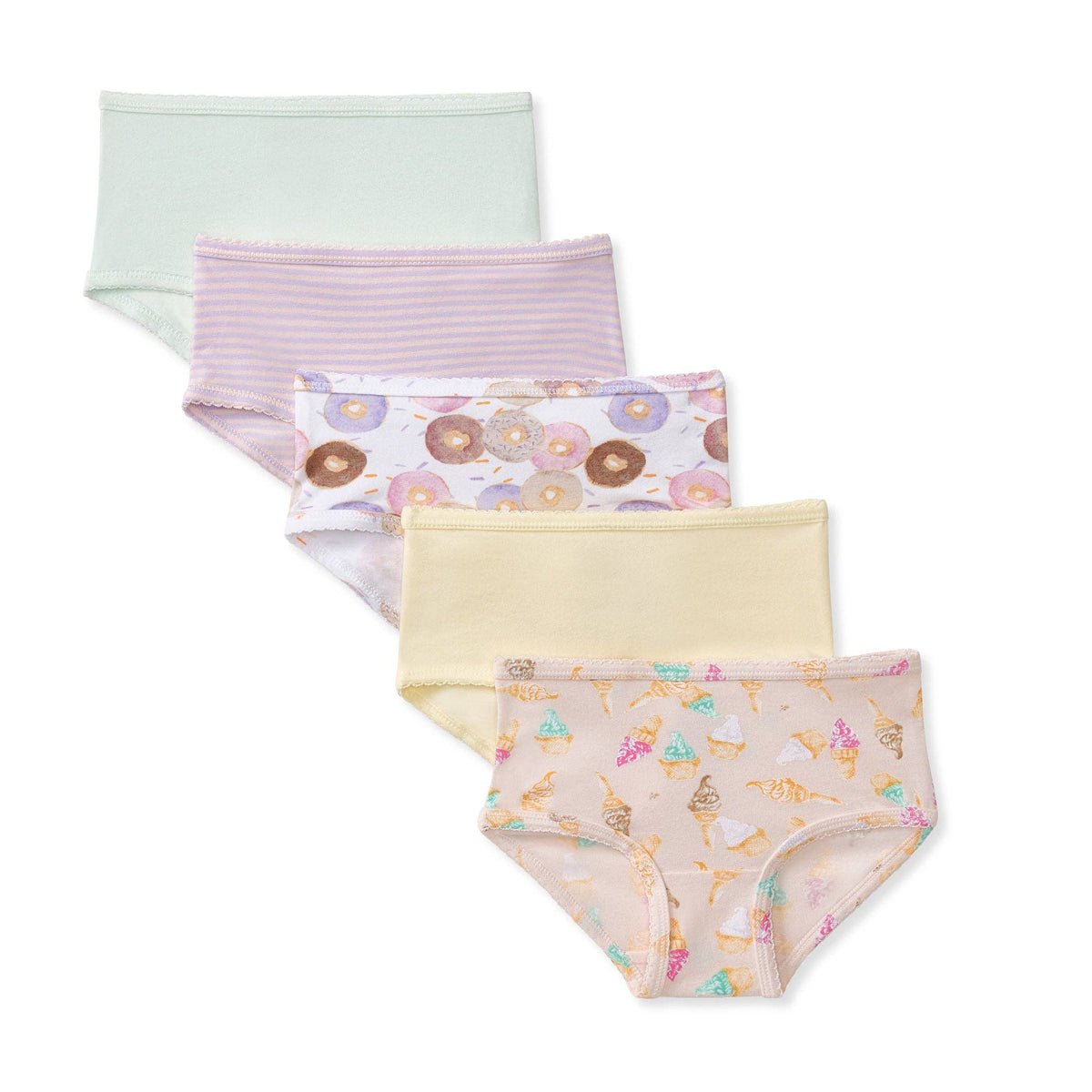 Four pairs of girl's brief underwear arranged in a staggered stack on a white background. The top pair is light mint green, the second has thin pink stripes, the third has a donut print on a white background, the fourth is pale yellow, and the bottom pair has a pastel multicolor ice cream cone print on a peach background.