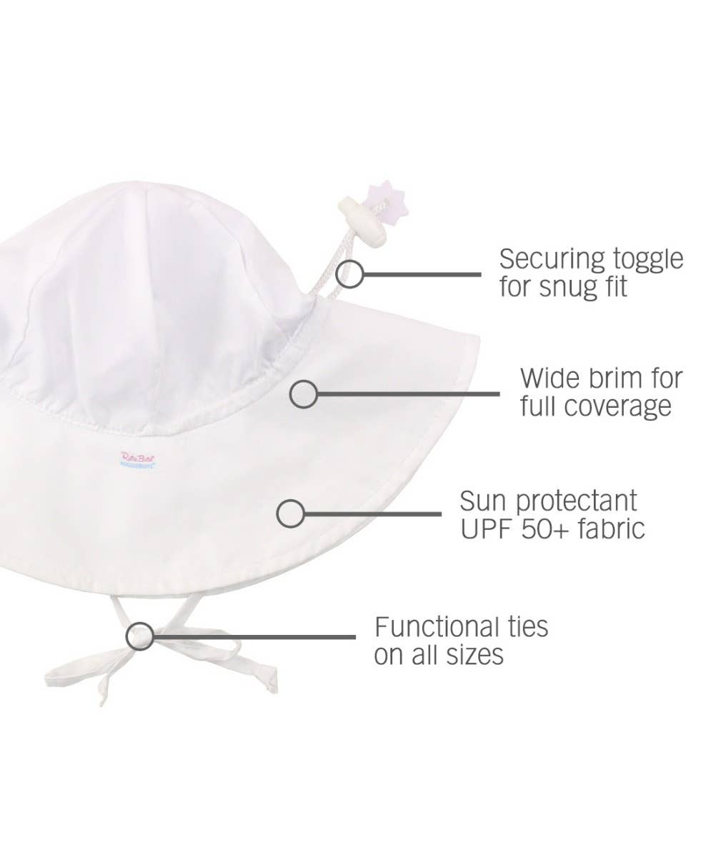 RuffleButts + RuggedButts - Kids Sun Protective Hat in white features a wide brim for full coverage, UPF 50+ sun protection, secure toggle for snug fit, and functional ties for comfort and safety.