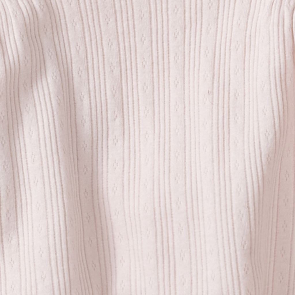 Soft, breathable fabric detail with ribbed texture and subtle diamond patterns from the Burt's Bees Baby - Parasols Tunic & Legging Set, perfect for stylish kids clothing.