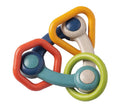 Speedy Monkey - Triangle Rattle with colorful interconnected shapes in soft, natural tones designed as a stylish, child-safe sensory toy perfect for modern baby boutiques.