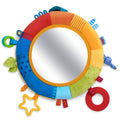 Rainbow Discovery Mirror with a soft, colorful fabric frame featuring textured and tactile elements for sensory play, perfect for babies and toddlers in a stylish children’s boutique.
