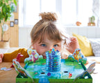 Young child playing the Dragon's Breath Game, a colorful and engaging educational toy encouraging imaginative play and sensory exploration in a cozy, well-lit room.