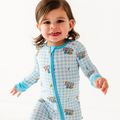 Child wearing a blue 'Little Bro' onesie on a white background