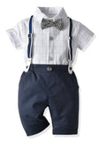 Fennco Styles - White & Navy Plaid Bowtie 3pcs Boy Outfit featuring a white short-sleeve checked shirt with black and white plaid bowtie, navy shorts, and matching suspenders, perfect for stylish kids clothing.
