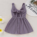 Fennco Styles - Front Tie Bowknot Gauze Cotton Girl Dress: Purple made from breathable gauze cotton fabric featuring a front tie bowknot and button accents, perfect for stylish kids clothing.