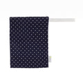 Itzy Ritzy - Travel Happens™ Medium Wet Bags: Nautical Navy Dots featuring a navy blue fabric with white polka dots, designed for stylish kids and practical mom life essentials.
