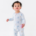 Baby wearing Kiki + Lulu - Peeps + Sleeps Convertible Footies featuring pastel bunny prints on soft fabric, ideal for cozy baby essentials from a curated children’s boutique.