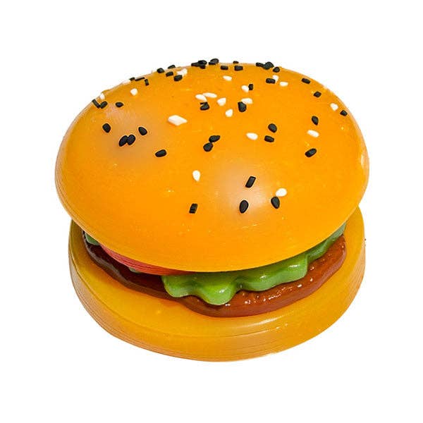 Toy hamburger with sesame seeds on a white background