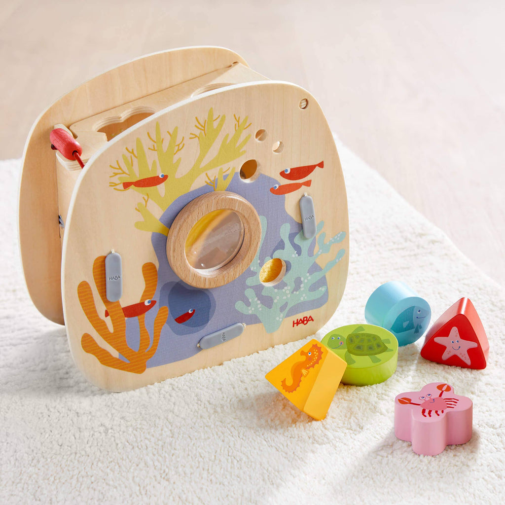 Underwater World Wooden Shape Sorter with colorful sea creature shapes designed for imaginative play, promoting sensory development and fine motor skills for toddlers.