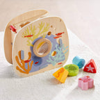 Underwater World Wooden Shape Sorter with colorful sea creature shapes designed for imaginative play, promoting sensory development and fine motor skills for toddlers.