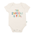 Cream-colored baby bodysuit with colorful text "THE SNUGGLE IS REAL" printed on front, featuring soft organic fabric, Finn + Emma - Baby organic graphic bodysuit | the snuggle is real from a curated children’s boutique.