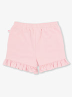 RuffleButts + RuggedButts - Girls Pink Knit Ruffle Trim Shorts: Pink, soft knit fabric with elastic waistband and delicate ruffle trim, perfect for stylish kids clothing in a curated children’s boutique.