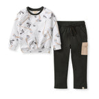 Burt's Bees Baby - Hockey Season Sweatshirt & Pants Set featuring a white sweatshirt with hockey stick and puck print paired with black pants with a beige pocket, cozy and stylish for babies.