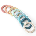 Itzy Ritzy - Bitzy Bespoke Itzy Rings™ Linking Ring Set: Rainbow in soft pastel colors, featuring textured, braided design, perfect baby accessories from a curated children’s boutique.