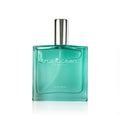 Clear turquoise glass perfume bottle with silver cap labeled True Ocean - Coastal - a beach perfume, showcasing a fresh and ocean-inspired scent for modern moms.