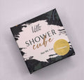 Villa Bain - Champagne Shower Cube packaged in a stylish black, white, and gold box with elegant text and a botanical design, perfect for mom life essentials.