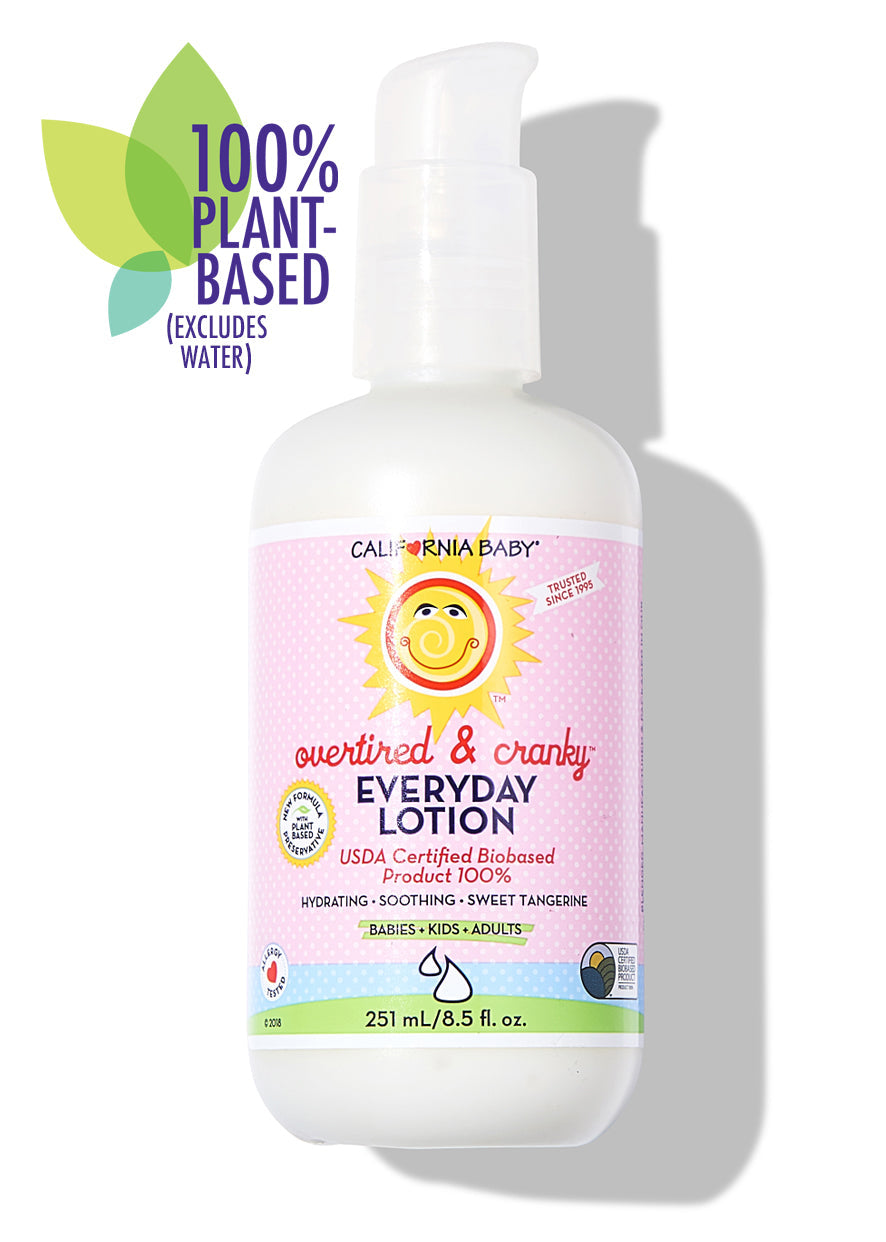 California Baby - Overtired & Cranky™ Everyday Lotion bottle with soft pink label, featuring hydrating, soothing formula for babies, kids, and adults, highlighting 100% plant-based ingredients.