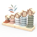 Speedy Monkey - Monkey Family Stacker wooden stacking toy with five smiling monkey faces and pastel-colored rings on a natural wood base, promoting playful learning for toddlers.