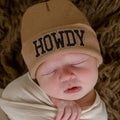 Newborn baby peacefully sleeping while wearing ilybean - Howdy Baby Hat - Newborn and Baby Hospital Hat: Tan Hat, styled with soft, cozy fabrics perfect for modern baby essentials.