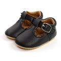 Black soft leather baby shoes with scalloped edges and buckle strap, designed for comfort and style, Urban Tots - Mary Jane Moccs - Black from a curated children’s boutique.