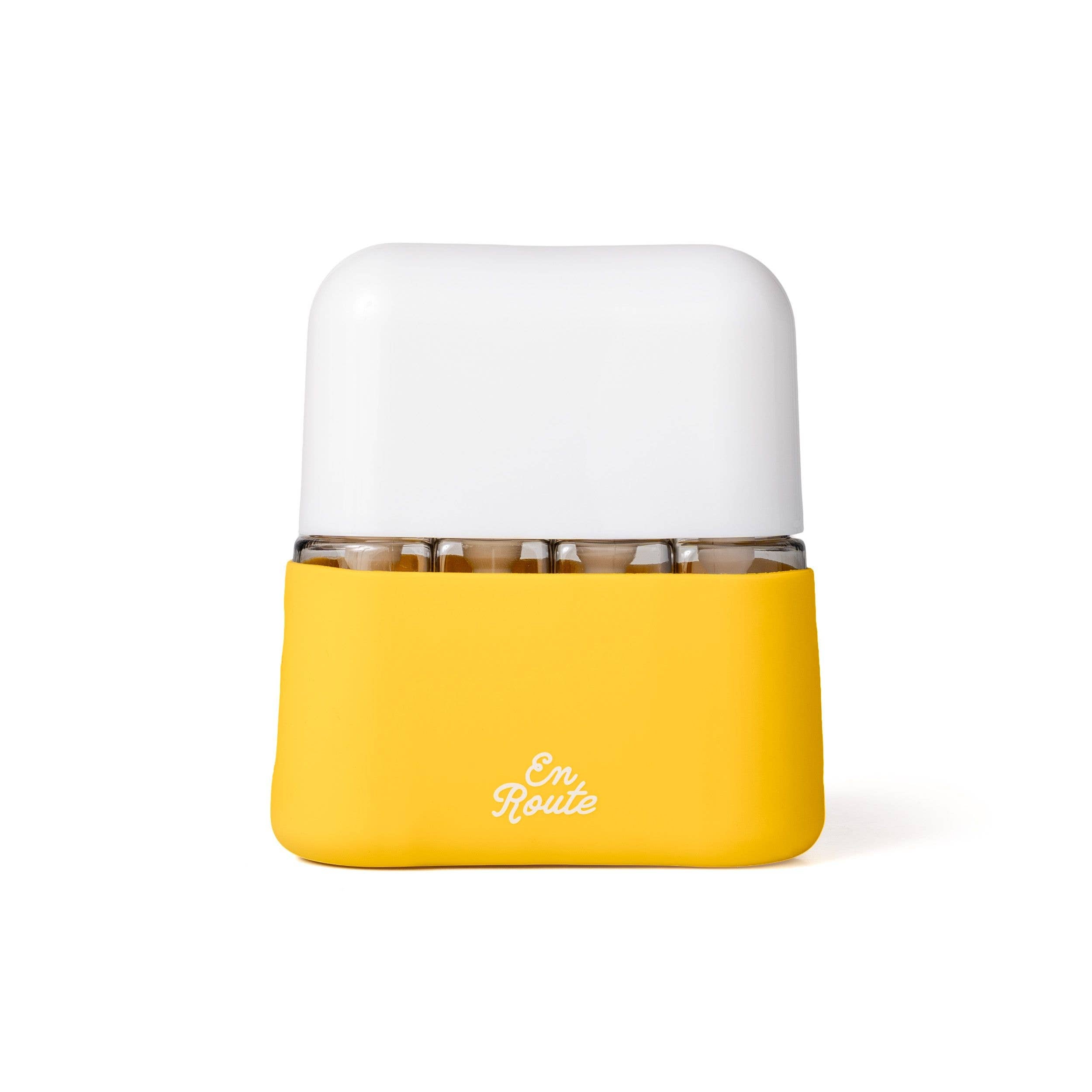 En Route - Bon Voyage 4 Piece Travel Bottles in a compact yellow and white case, ideal for stylish kids accessories and practical mom life essentials.