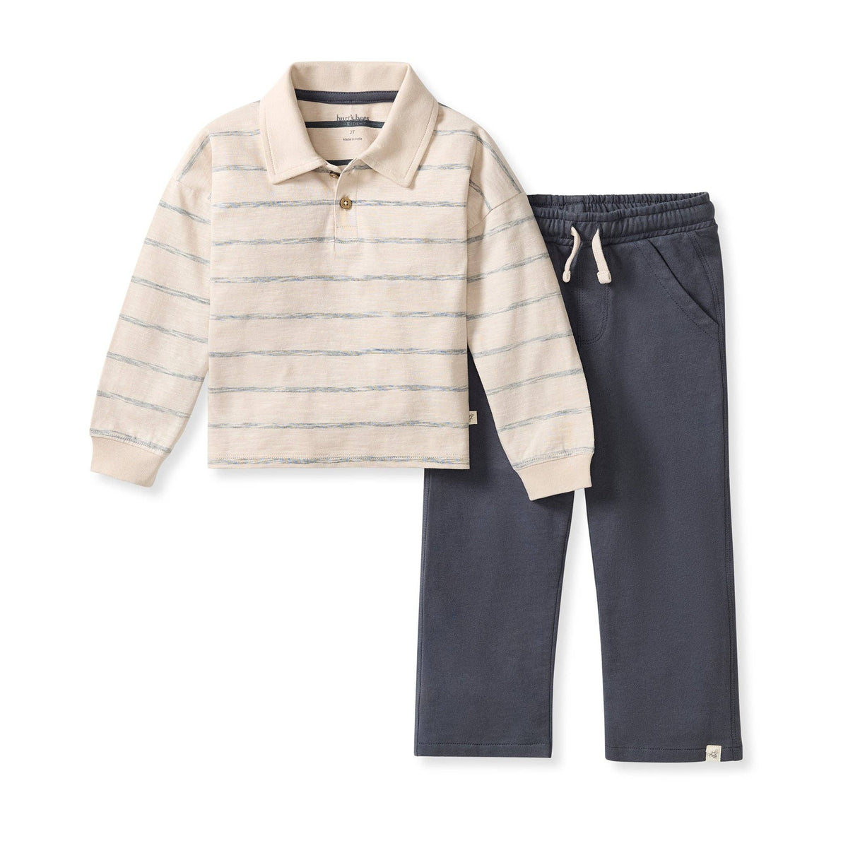 Children's outfit with striped long-sleeve shirt and dark pants on a white background