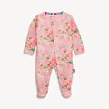 A baby footed sleeper in light pink with a colorful floral print, featuring long sleeves, an asymmetrical snap closure, and a striped collar.