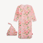 Floral baby onesie and hat set on a white background