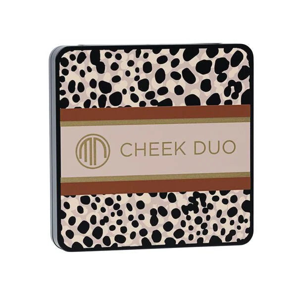 Compact makeup palette with a stylish spotted design on the case, featuring the Merle Norman Cosmetics - Backstage Cheek Duo (Limited-Edition) text in gold lettering.