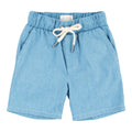 Light blue children’s shorts made of soft chambray fabric with an elastic waistband and white drawstring, perfect for stylish summer wear, called Miki Miette - Chambray Logan Shorts.