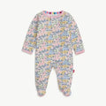 Floral patterned baby onesie on a white background