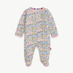 Floral patterned baby onesie on a white background