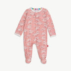 A baby footed sleeper in dusty pink with a white cherry blossom pattern, featuring a colorful striped inner collar and a small red tag on the side.