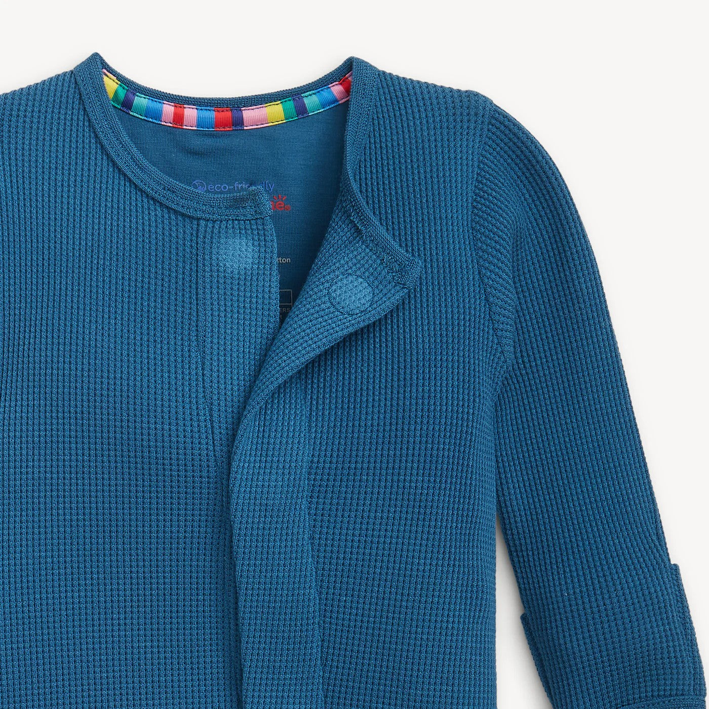 Blue textured waffle pajamas on a white background