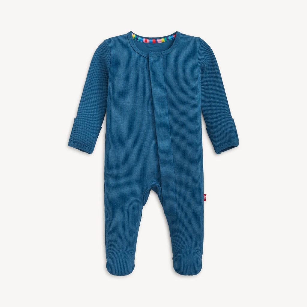 Blue baby onesie with footies on a white background