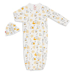 A baby sleep sack and matching hat set in white, featuring a playful print of honey bees, honeycombs, and small yellow flowers. The brand 'mimic organic' is visible on the inner neck label.