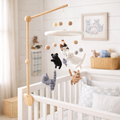 Mobile - Felt Baby - Cat hanging above a white crib in a cozy nursery, featuring soft neutral colors, wooden arm, and wool felt cat figures for soothing sensory play.