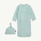 A baby sleep sack and matching knotted beanie set in a light mint green ribbed fabric, displayed on a clean off-white background.