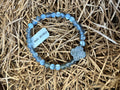 BeYoutiful Vibes - Stretch Bracelet ~ Mystic Quartz & Druzy Gemstone with soft blue and gray beads, featuring a sparkly druzy centerpiece, styled on natural straw background.