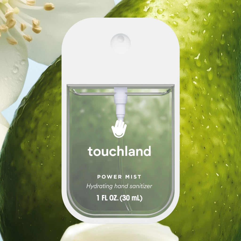 Touchland hand sanitizer power mist with green apple and flowers in the background