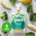 Sophie's Organics - Dream (6-pack) broccoli and pear organic baby food pouch surrounded by fresh broccoli florets and pear slices, highlighting natural ingredients and cozy baby essentials.