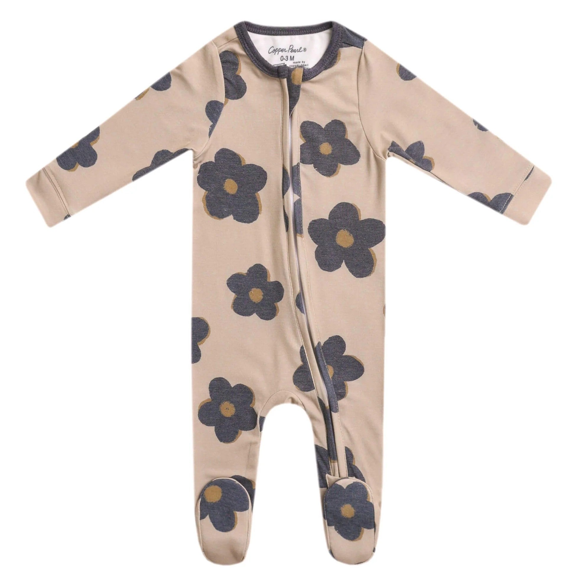 Zip-up beige footie pajama lying flat on a white background with flowers in grey color. 