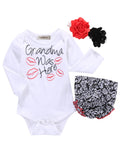 Fennco Styles - Grandma was Here Baby Romper, Bloomers, Headband 3pcs set featuring a white long-sleeve romper with playful text and red lips, black and white floral bloomers, and matching red and black flower headbands, perfect for stylish little ones and thoughtful baby gifts.