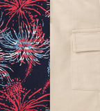 Close-up of fabric details showing red, white, and blue firework patterns on navy and a beige pocket detail from Burt's Bees Baby - Celebrate America Toddler Boys Shirt Only, curated children’s boutique stylish kids clothing.