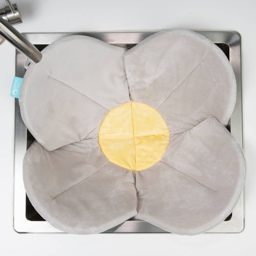 Blooming Baby - Blooming Bath Poppy: Gray/Yellow soft flower-shaped baby bath cushion with plush gray petals and a yellow center, designed for cozy bath time comfort.