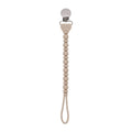 Itzy Ritzy - Sweetie Strap™ Silicone One-Piece Pacifier Clips: Toast in soft neutral beige with bead design and metal clip, stylish baby accessory from a curated children’s boutique.
