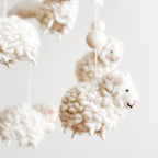 Soft, neutral-toned Mobile - Felt Baby - Counting Sheep hanging decoration featuring cozy, handcrafted felt sheep for a stylish baby accessory in a curated children’s boutique.