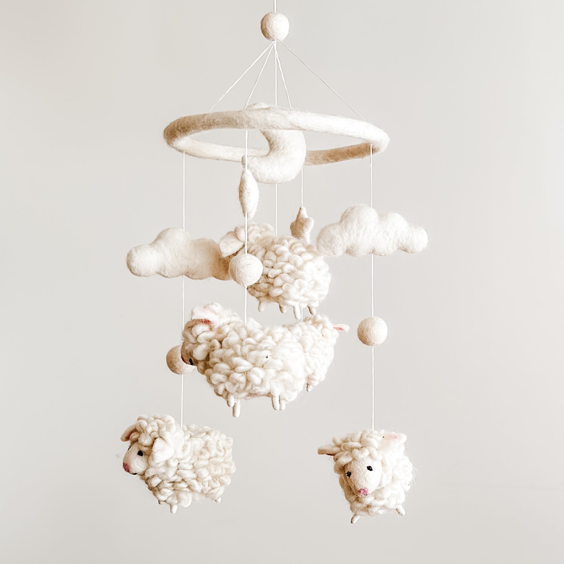 Mobile - Felt Baby - Counting Sheep featuring soft, neutral-toned felt sheep and clouds, designed as a cozy, stylish baby accessory for modern nurseries.